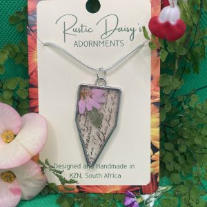 transparent-medium-large-arrow-head-shaped-silver-coloured-pendant-with-script-backing-and-pink-daisy-with-leaf