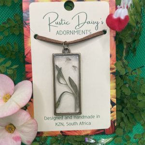 transparent-medium-large-rectangular-bronze-coloured-pendant-with-sprig-of-leaves-and-tiny-white-wild-flowers