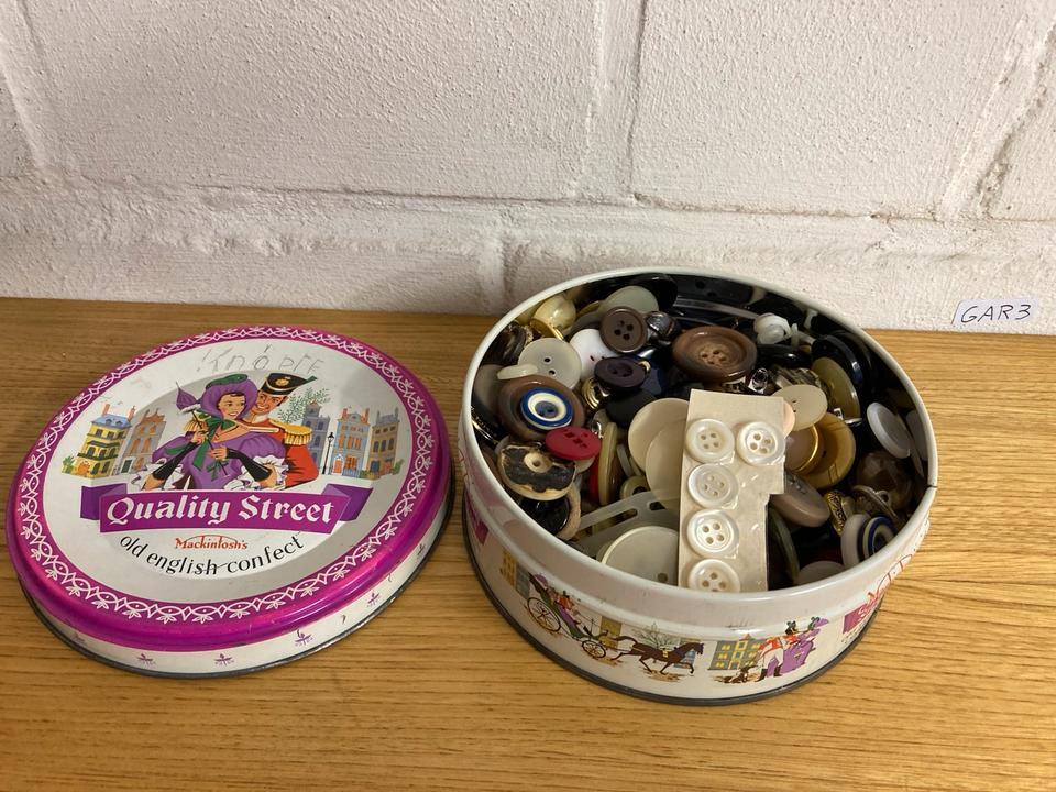 Vintage Quality Street tin filled with sewing buttons found while helping parents declutter a family home